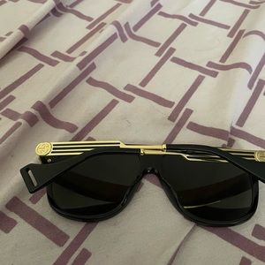 Black and gold Gucci Glasses